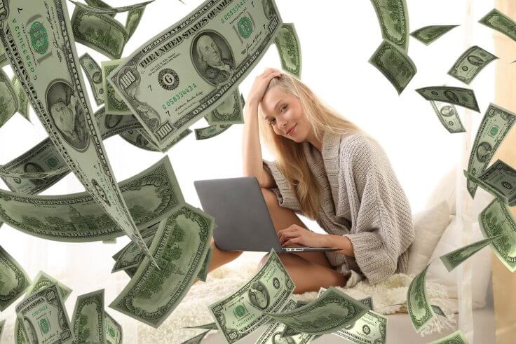 Blonde lady smiling with money flying everywhere - Path to financial freedom