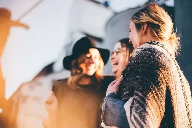 10 Ways to Attract Good Vibes and Elevate Your Life friends laughing